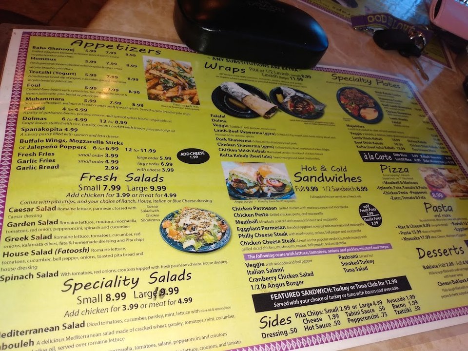 Printed menu showing Mediterranean dishes and small plates.